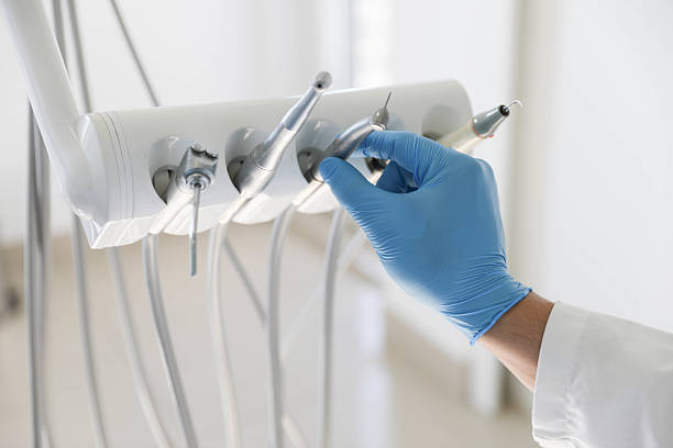 Professional Tooth Extraction technician working in Palo Alto, CA